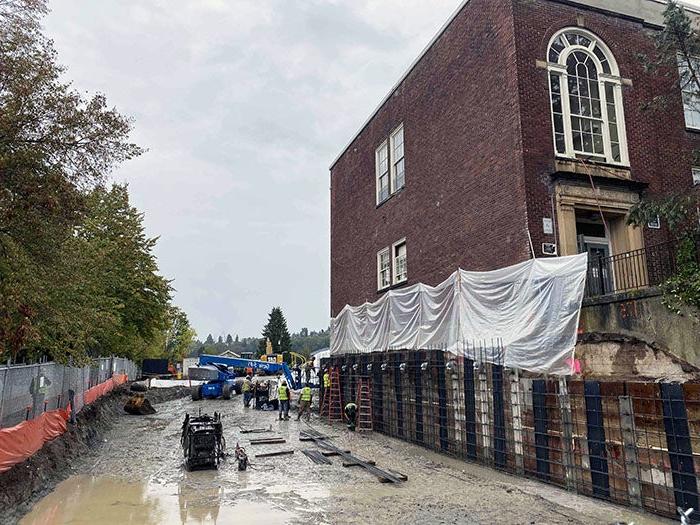 a brick building with construction in progress on the outside